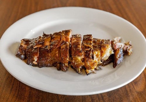 A plate of ribs, served by Smokin' Notes BBQ in East Peoria IL